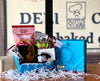 Blue gift box filled with sweet and savory treats, all made in Michigan.